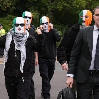 Photo of the band Kneecap after their win in court