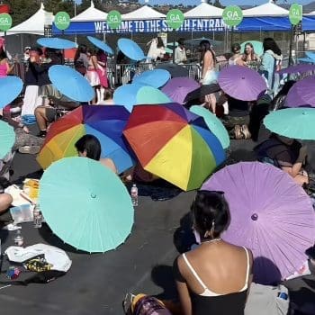 A rainbow of parasols provided as shelter from the sun for fans waiting in line at Chappell Roan at the Rose Bowl